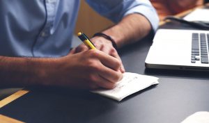 writing notes on notepad